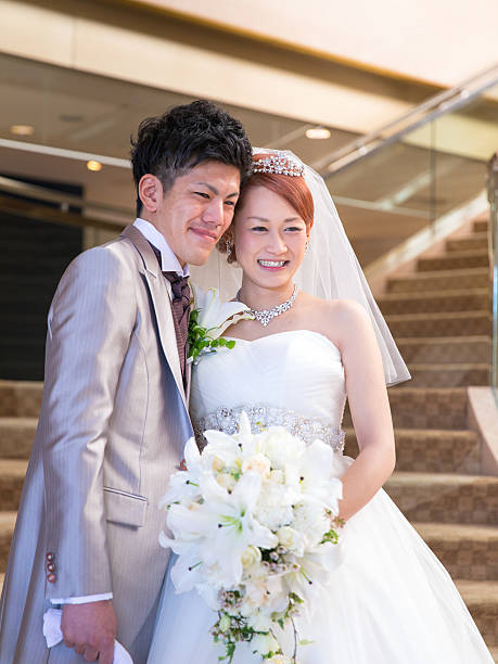 Bride and groom smiling on stairs