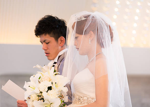 istock Bride and groom singing a song in chapel 639004978