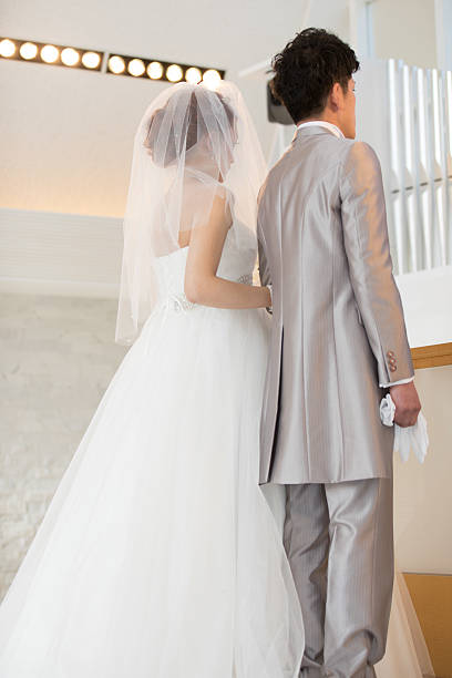 istock Bride walking forward in chapel at wedding ceremony 639005006