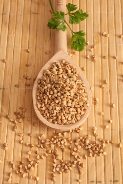 istock Buckwheat and wooden spoon 639005056