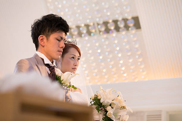 istock Bride and groom in chapel for wedding ceremony 639005112