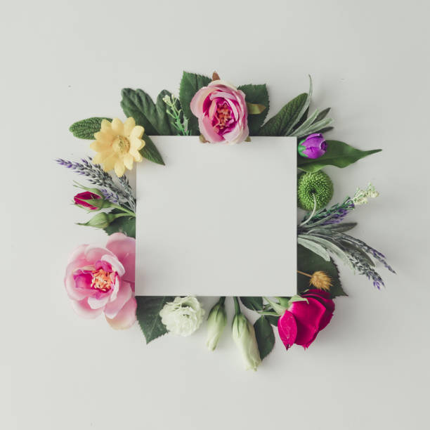 istock Creative layout with colorful flowers, leaves and copy space car 639005928