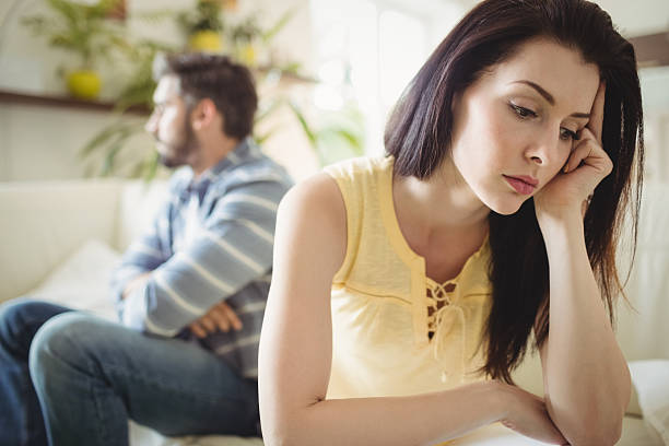 istock Upset couple ignoring each other on sofa 639008440