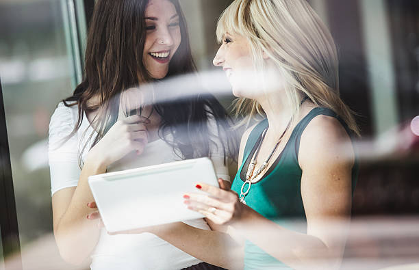istock Woman Friends using digital tablet 639010944