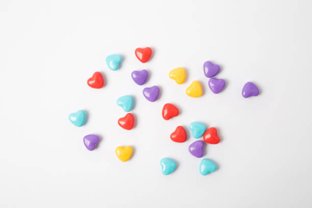 istock Miniature plastic hearts on white background 639014820