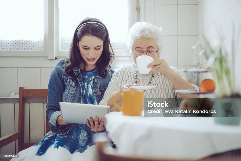 Social worker is visiting a senior woman Winter Stock Photo