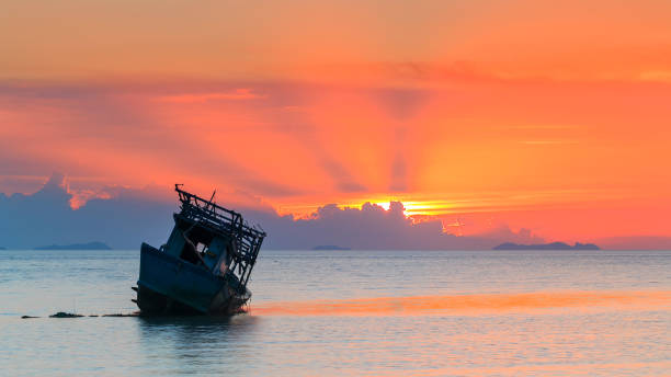 istock abandoned boat at the sea in sunset Time 639015204