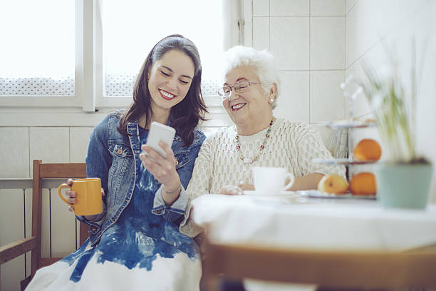 Social worker is visiting a senior woman