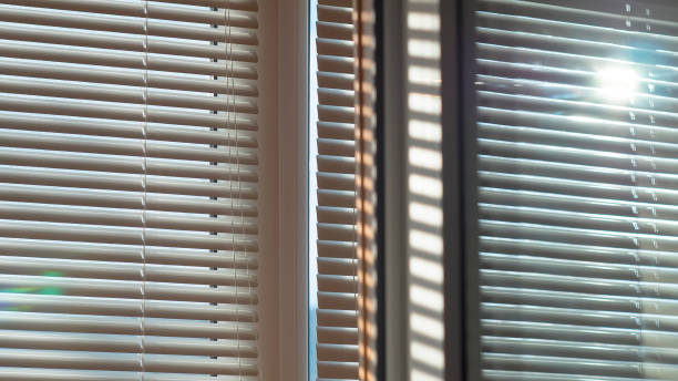 istock Sun is shining and glowing through the blinds 639015456