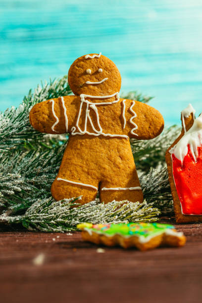 istock painted gingerbread house, Christmas tree and the man on a 639016804
