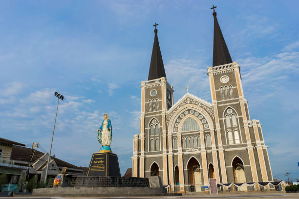 istock Virgin mary with church and blue sky 639019452