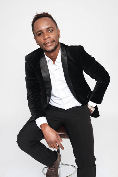 istock Young african businessman sitting on stool. 639019636