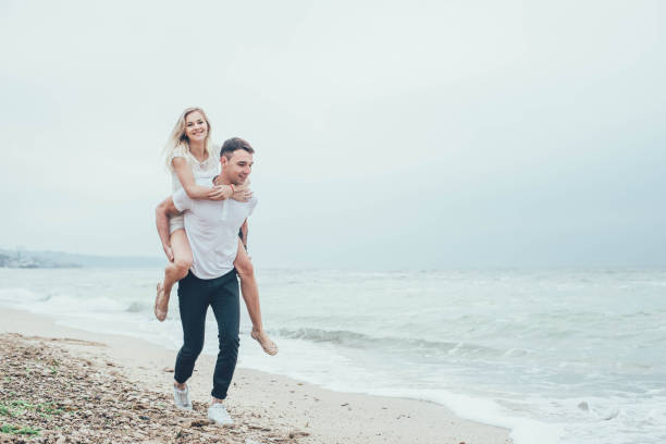 istock couple having fun on beach 639021542