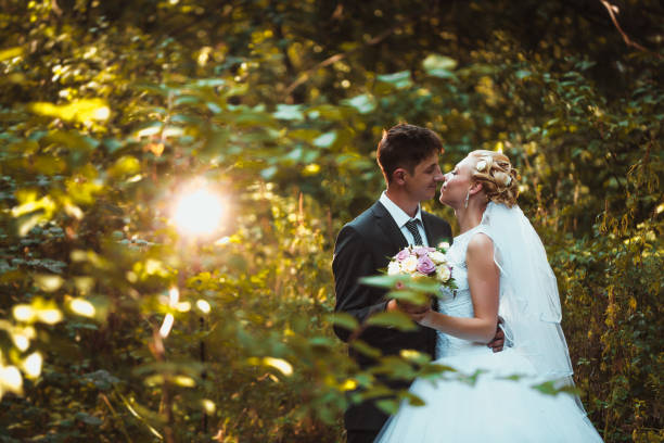 istock bride and groom on the forest background 639021708