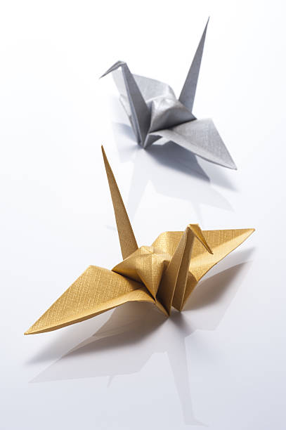 istock origami crane on white background 639022510