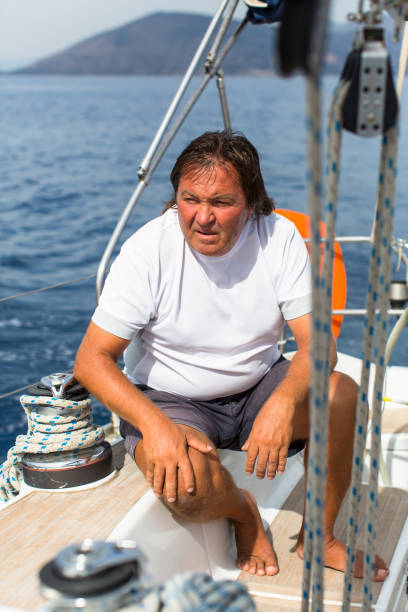 istock Man sits on his sailing yacht. 639023390
