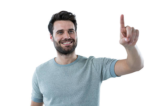 istock Smiling man pretending to touch an invisible screen 639025312