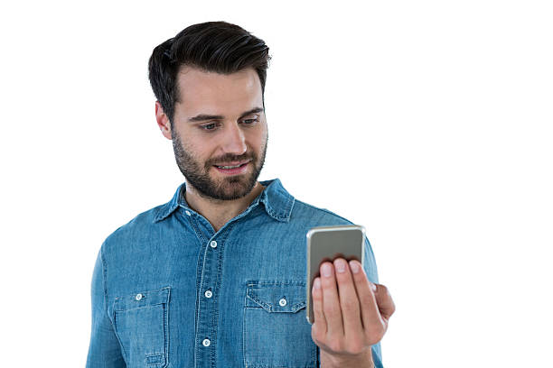 istock Smiling man looking at mobile phone 639025468