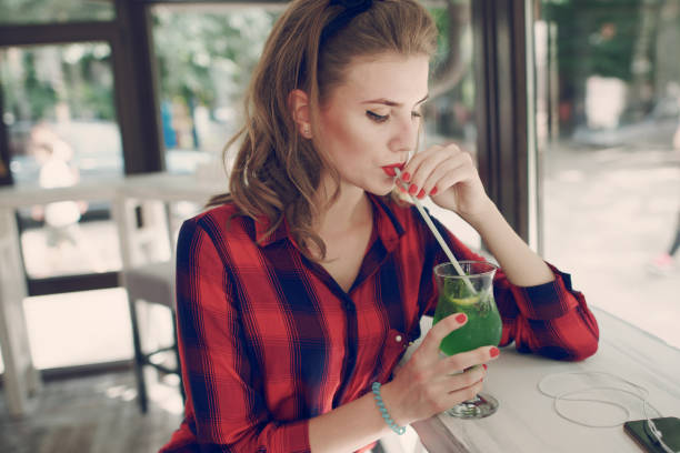 istock Woman Sipping Drink 639026214