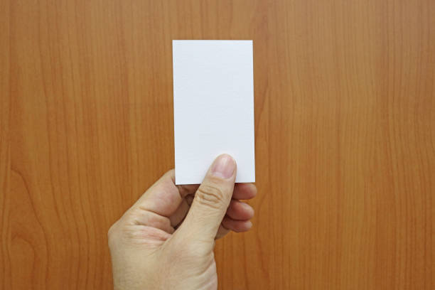 istock hand holding a blank business card 639026274