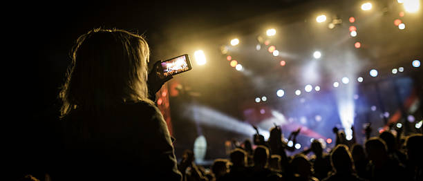 istock Person filming a concert 639026966