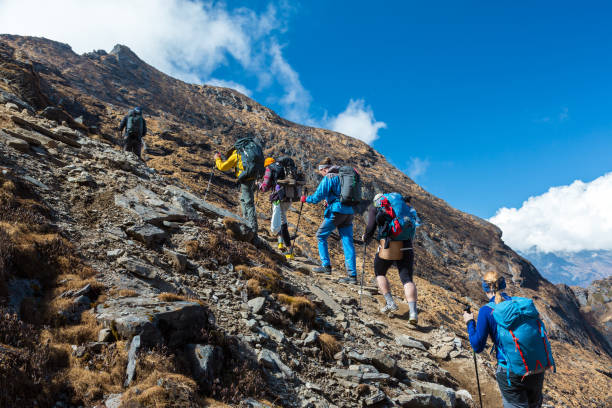 istock Mixed Group of Athletes ascending Mountain 639028166
