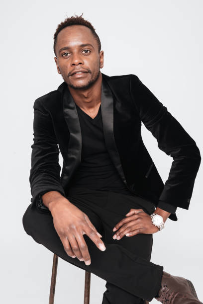 istock Handsome attractive businessman sitting in studio. 639028216