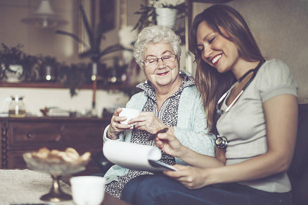 istock Social worker is visiting a senior woman 639028480