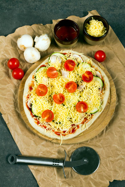 istock Pizza with courgette, tomatoes and mushrooms, cauliflower crust. 639028680