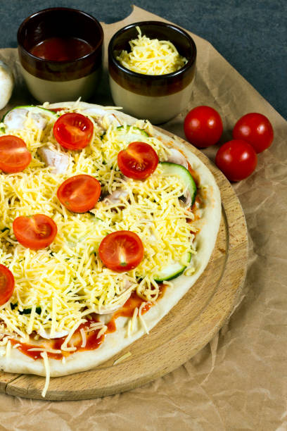 istock Pizza with courgette, tomatoes and mushrooms, cauliflower crust. 639030610