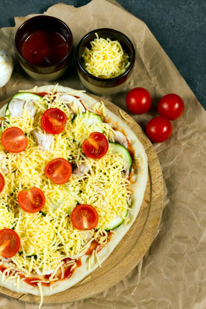 istock Pizza with courgette, tomatoes and mushrooms, cauliflower crust. 639030794