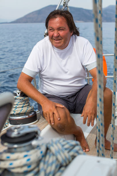 istock Mature man sitting on a sailing yacht. 639031106