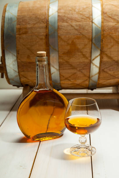istock glass of cognac and a bottle 639032570