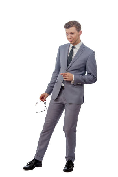 istock man with glasses in a tie smiling and pointing her 639032894