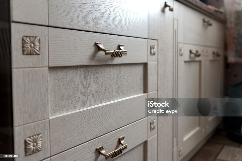 retro metal cabinet knobs in the kitchen Cabinet Stock Photo