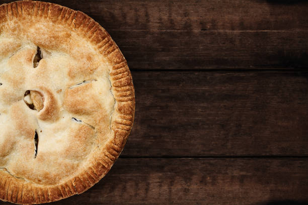 istock Apple Pie Over a Dark Wooden Table Top 639035264