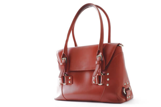 istock Red glossy female leather bag isolated on white background 639035496