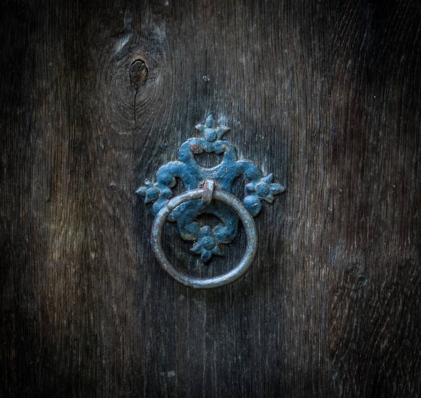 istock The Old rusty ring on a wooden door 639036202