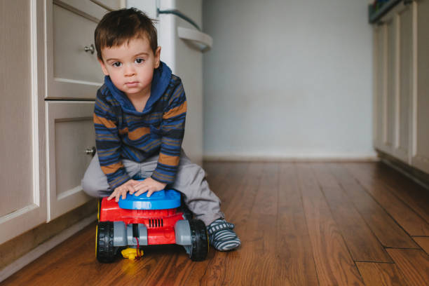 istock Cute Toddler Boy Playing in the Kitchen 639041114