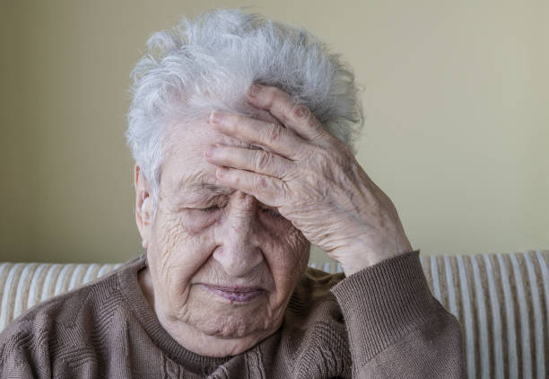 istock ill senior woman has headache 639042790