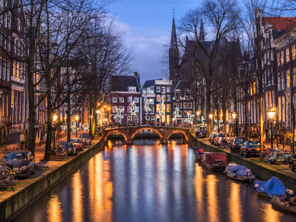 Amsterdam canal and bridge in the evening stock photo