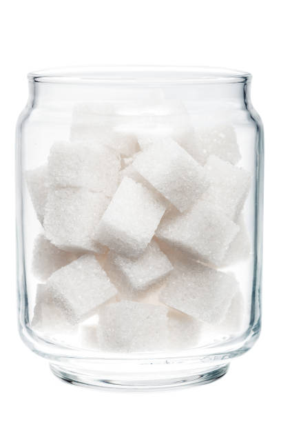 istock White lump sugar in a glass jar. 639050762