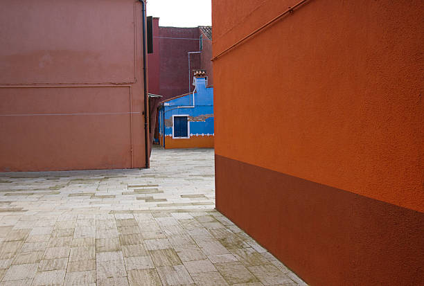 istock Burano, Venice: Vibrant Orange and Blue Buildings Architectural Details 639050876