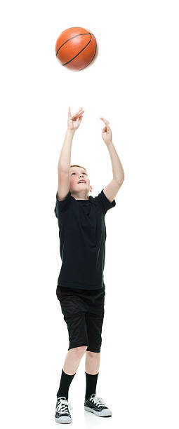istock Little boy playing with basketball 639054158