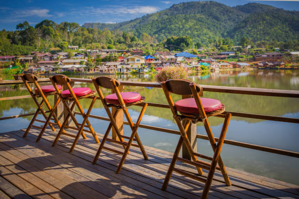 istock Lonely empty chairs on a deck at rak Thai Village. 639055830