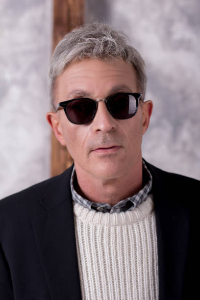 Portrait of a man in black jacket with dark glasses stock photo
