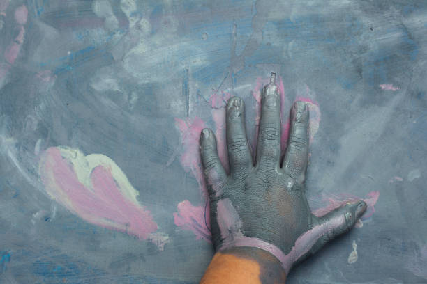 istock Childs painted hand over a painted wood surface 639059604