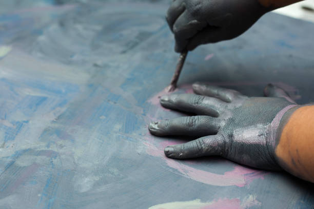 istock Childs painted hand over a painted wood surface 639059666
