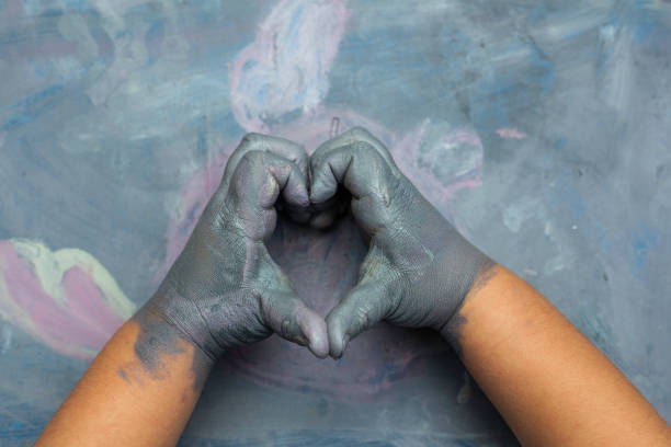 istock Childs painted hands simulating a heart 639059790