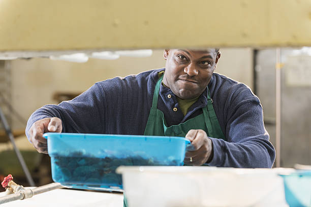 Black man working in seafood processing plant
